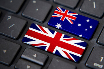 UK and Australia flags on computer keyboard