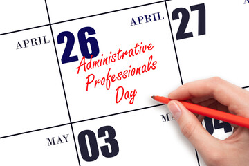 April 26. Hand writing text Administrative Professionals Day on calendar date. Save the date.