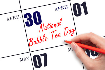 April 30. Hand writing text National Bubble Tea Day on calendar date. Save the date.