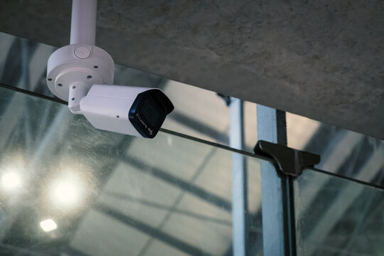 CCTV, indoor security camera on ceiling of modern building to monitor and record things happen for safety
