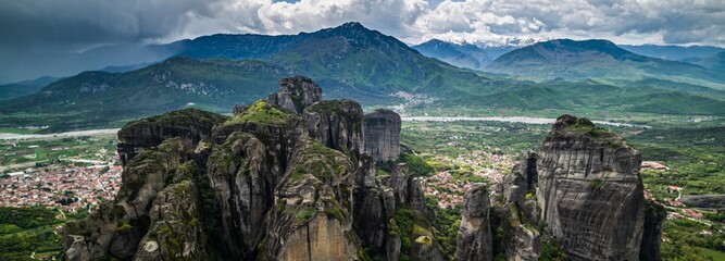 Cloud Dance: Tracking Shot of Meteora's Landscape with Sandstone Rock Formations and Ancient...