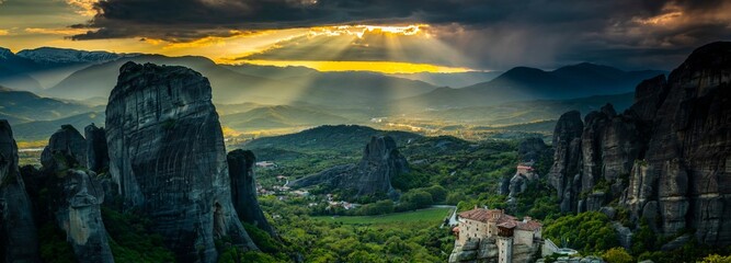 Cloud Dance: Tracking Shot of Meteora's Landscape with Sandstone Rock Formations and Ancient...