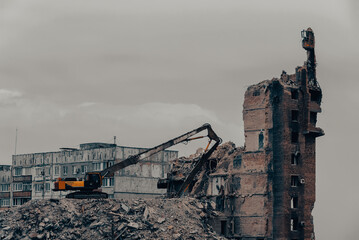 construction equipment destroys affected houses war in Ukraine