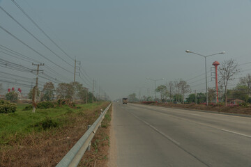 Photos in the highway road and toxic haze in the city. Concept of Pollution PM2.5 Unhealthy air...