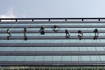 Professional window cleaning working in tower business center