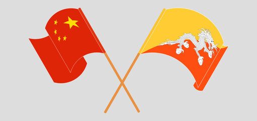 Crossed and waving flags of China and Bhutan