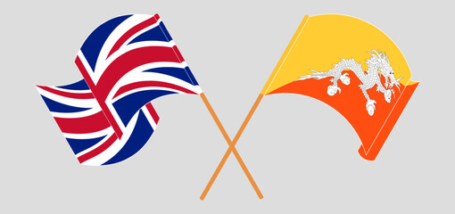Crossed and waving flags of United Kingdom and Bhutan