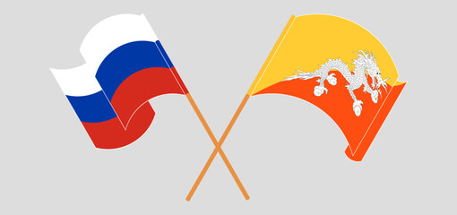 Crossed and waving flags of Russia and Bhutan