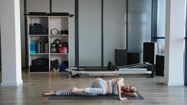 Pregnant Trainer Illustrates Safe Floor Exercise for Prenatal Fitness