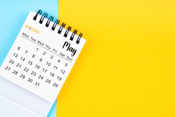 May 2024, Monthly desk calendar for 2024 year on yellow and blue color.