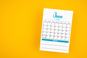 June 2024 calendar page on yellow background. - obrazy, fototapety, plakaty