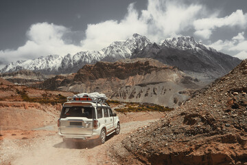 Off-road travel on extreme high mountain road in Upper Mustang, Nepal. Nice view of the Himalaya...