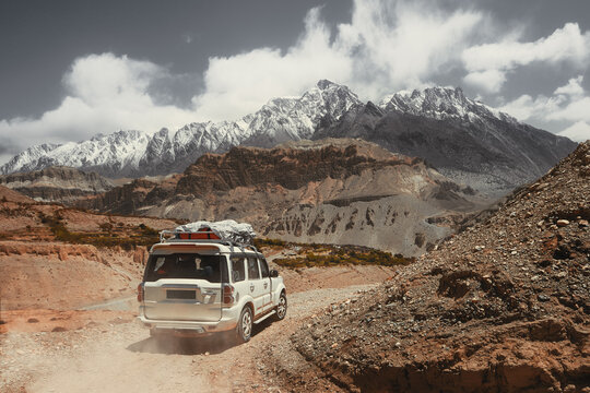 Off-road travel on extreme high mountain road in Upper Mustang, Nepal. Nice view of the Himalaya Mountains.