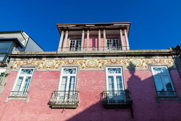 Facade of an old classic red building, Braga, Portugal