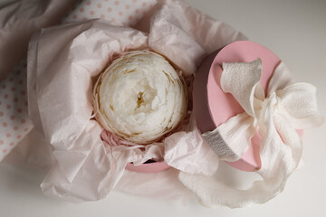 handmade candle in the shape of a flower in a gift box