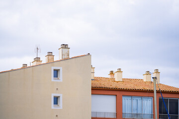 Fototapeta na wymiar tile roof zoom and chimney - Cap d'Agde, France