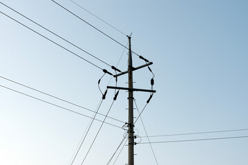 View of the electricity transmission pole in the blue sky