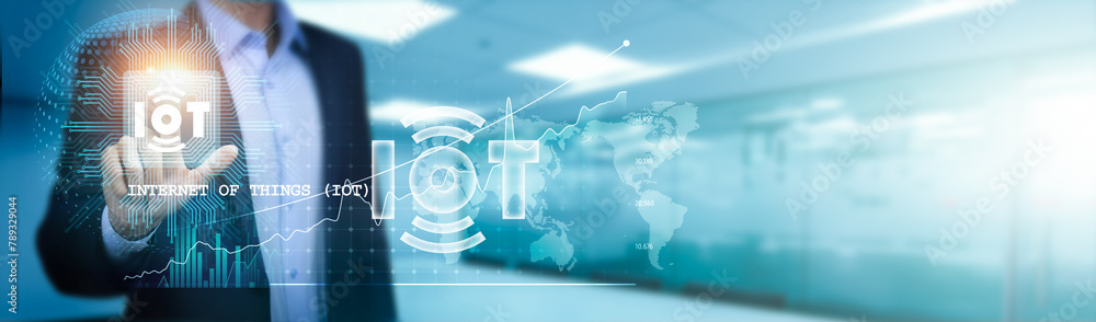 Poster internet of things (iot), a businessman touches a circuit board to manage, monitor, and control devi