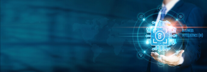 Businessman hand-holding business intelligence (BI) icons with analytics, data visualization, and network connections. Strategically leveraging insights for informed decision-making.