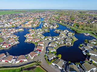 Aerial drone view geometric pattern of water houses, marina, yachts Marina Park Lemmer Netherlands