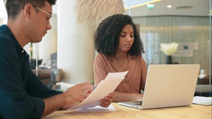 Busy diverse professional employees using laptop discussing document in office. Business team two man and woman talking working together. African American bank manager consulting client at meeting.