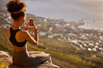 Photography, peace or woman with smartphone on mountain for yoga, train or exercise for wellness,...