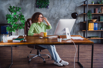 Photo of dreamy nice woman sitting table enjoying tasty coffee cappuccino looking window workspace...