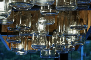 a lot of empty cans with a lighting lamp on the ceiling in the store, a close-up photo    