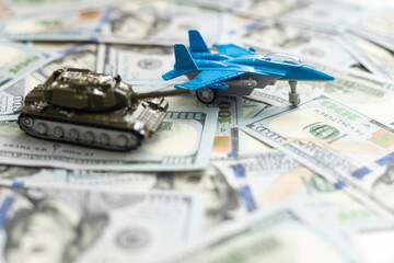 military fighter plane and dollars on a white background.  - 789343044