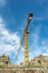 Construction crane working on large construction site