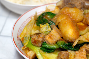 Pochero is a Philippine dish stew made of pork, saba bananas, beans, and vegetables and often cooked in tomato sauce.