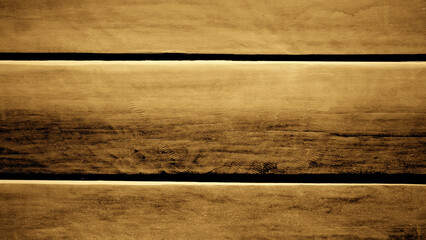 Reflective hardwood plank background with golden brown gradient. For backdrops, banners, scenes, autumn, old, dark.