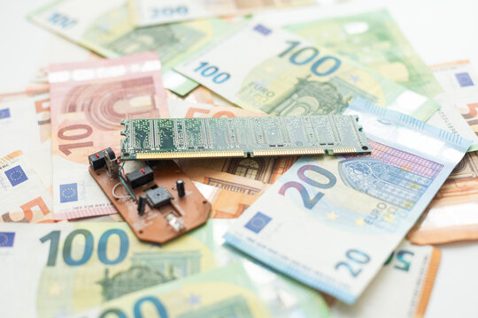 Close-up of EURO banknotes with microprocessors on top - Powered by Adobe