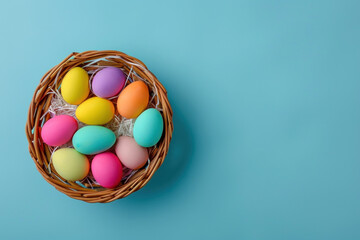 Fototapeta na wymiar colorful pastel easter eggs in a basket on a blue background