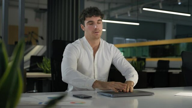 Tired exhausted Caucasian businessman finish work night evening office sleeping relax on computer on table need sleep insomnia disorder fatigued male overworked overtime working business man deadline