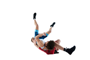 Male wrestlers involved in intense competition, each fighting to assert dominance isolated on white...