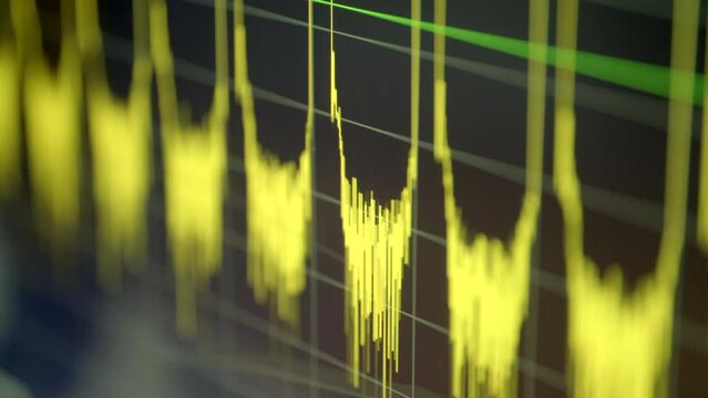 Digital oscillogram of electric signal on oscilloscope screen, close-up real time handheld shot, selective focus