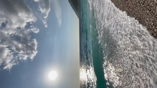 Rocky beach and crystal turquoise water of Ionian Sea in Albania