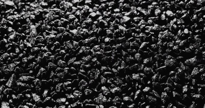 Black stones. Abstract background. Black sand grunge background. Сlose-up.