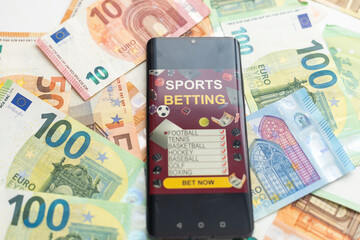 dollars and euros, smartphone with sports bet application
