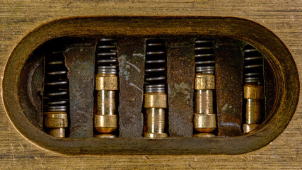 Extreme close up macro photograph of the inner mechanical mechanisms of a house pin tumbler lock