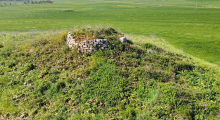 ruins of a nuraghe seen from above taken during excavations