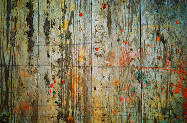 Vintage wooden boards splattered with orange paint texture