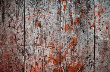 Vintage wooden boards splattered with red paint texture backdrop