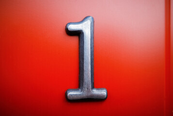 Vibrant steel plaque with number ONE object backdrop