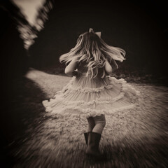Little girl spinning her dress