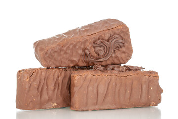 Three pieces of chocolate waffle cake, macro, isolated on white background.