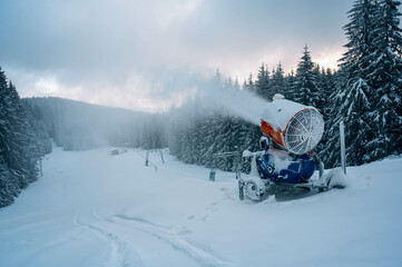 Snow cannon in winter mountains.