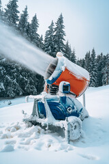 Snow cannon in winter mountains.
