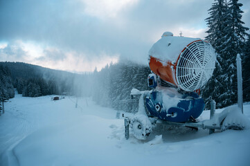 Snow cannon in winter mountains.